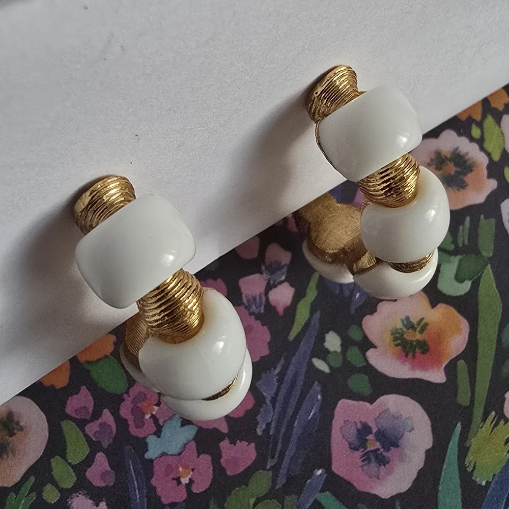 Vintage Trifari earrings Crown hoop white plastic gold tone metal clip on